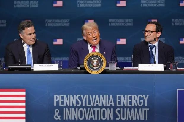 President Donald Trump, center, speaks at the "Inaugural Pennsylvania Energy and Innovation Event" at Carnegie Mellon University, Tuesday, July 15, 2025, in Pittsburgh, as Sen Dave McCormick, R-Pa., left, and Jon Gray, President and Chief Operating Officer, Blackstone, right, look on. (Gene J. Puskar/AP)